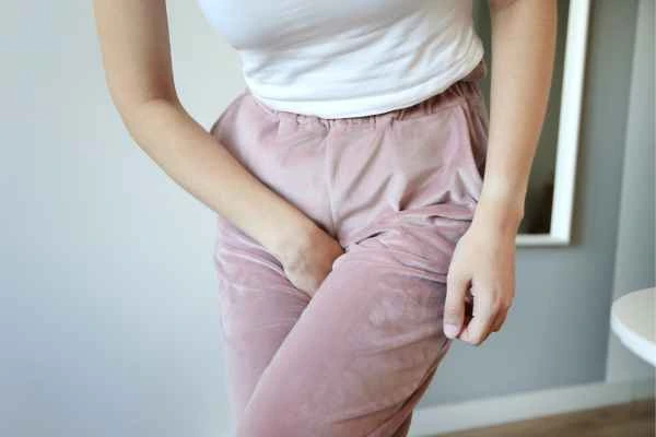 woman running for the toilet because of urinary incontinence Macclesfield